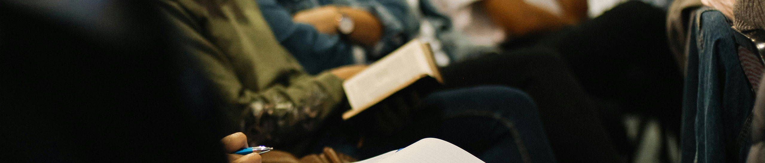 Audience member with book